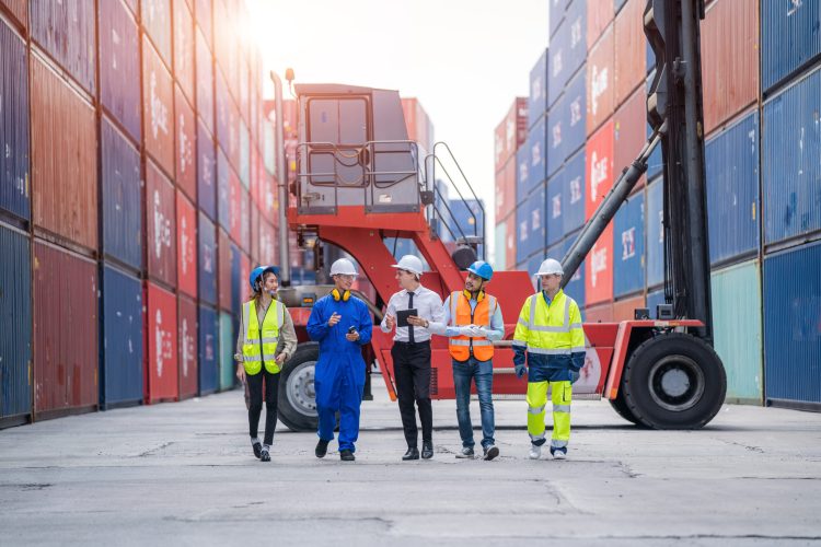 Manager and Cargo container worker having discussion on working plan together in the container yard,Logistics transportation and shipping business concepts